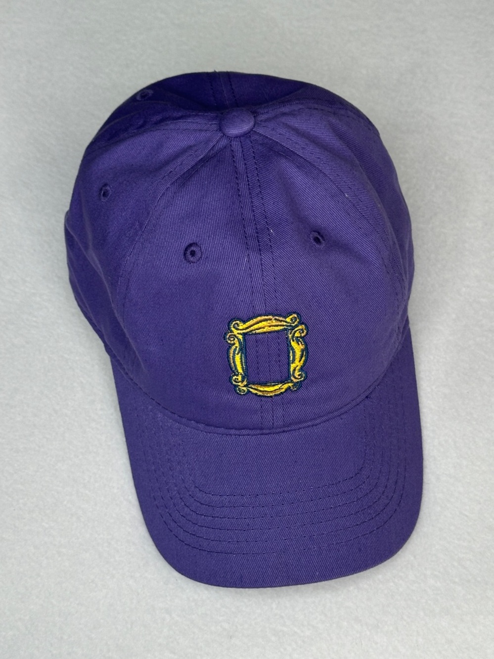 Purple Friends TV show peephole frame strapback baseball cap